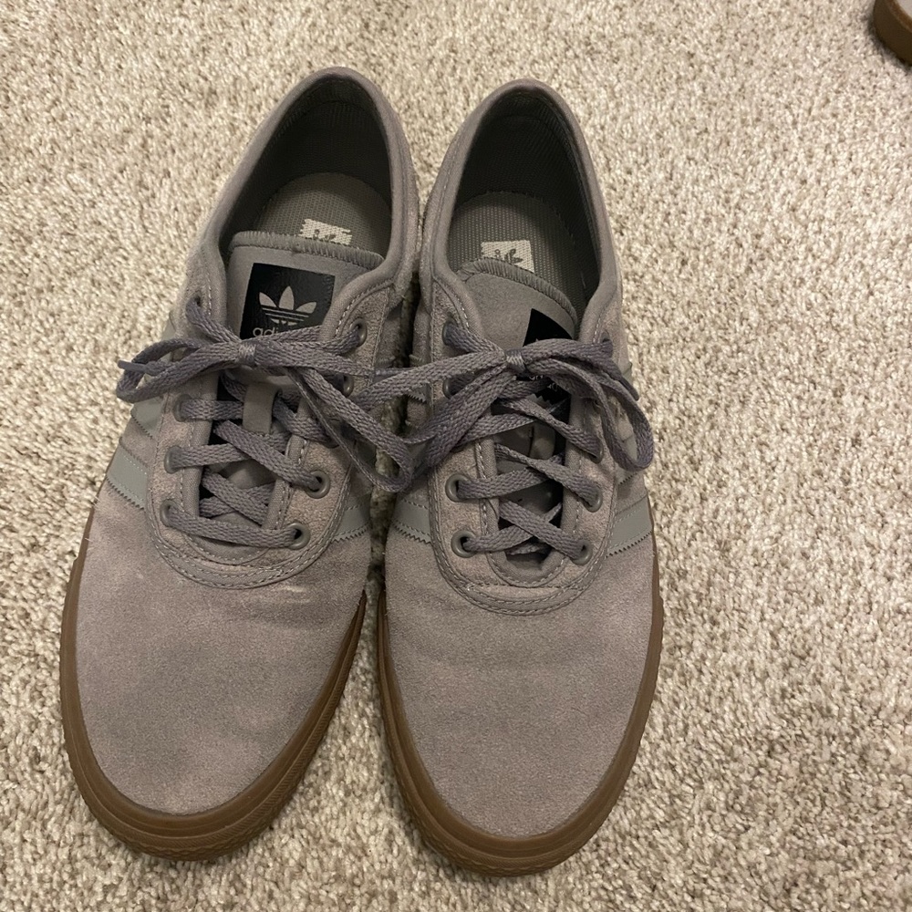 Adidas shoes with gum sole.